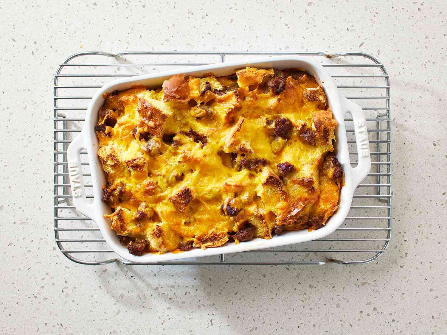 Easy Sausage Strata in a baking dish on a wire cooling rack 